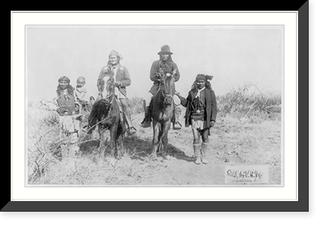 Historic Framed Print, [Scene in Geronimo's camp...before surrender to General Crook, March 27, 1886: Geronimo and Natches mounted; Geronimo's son (Perico) standing at his side holding baby],  17-7/8" x 21-7/8"