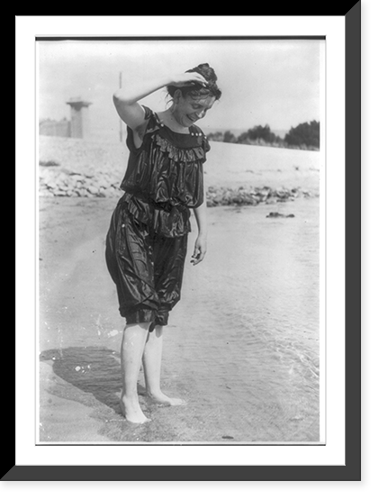 Historic Framed Print, [Frances Benjamin Johnston, standing in surf in wet bathing suit],  17-7/8" x 21-7/8"
