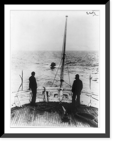 Historic Framed Print, [Coast Guard Cutter, USS Seneca chasing and capturing a rum runner" 1924: view from stern; rum runner in tow]",  17-7/8" x 21-7/8"