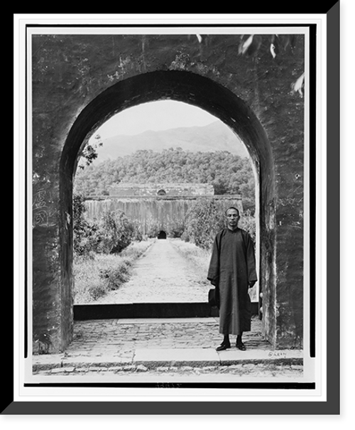 Historic Framed Print, [Kai-Shek Chaing, 1886- , full, standing, in portal, wearing robe, facing front.],  17-7/8" x 21-7/8"