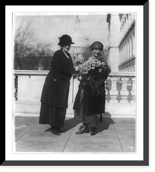 Miss Alice Robertson of Okla. presenting her new collegue sic, Mrs. Winifred Mason Huck with flowers on the latter's arrival at the House Office Building, Antique Print