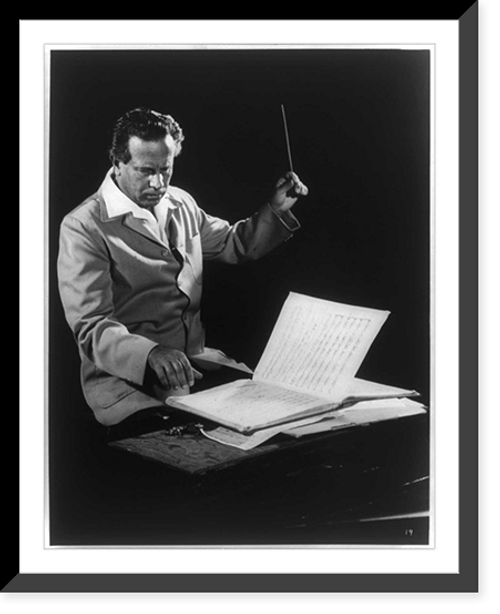 Historic Framed Print, [Antal Dorati, half-length portrait, seated, holding baton and looking at music sheet, facing right],  17-7/8" x 21-7/8"