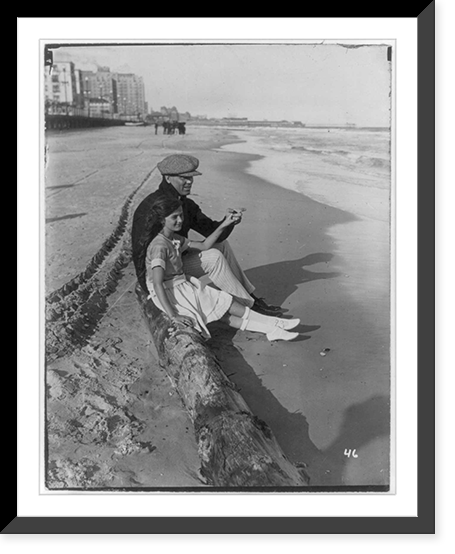 Jack Dempsey at his training camp, June 1921: sitting on beach with daughter, Vintage Print