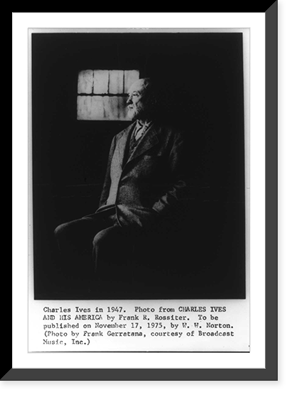 Historic Framed Print, [Charles Edward Ives, 1874-1954, full length portrait, seated, facing left],  17-7/8" x 21-7/8"