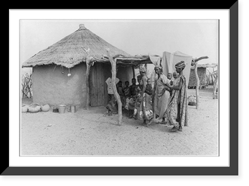 Historic Framed Print, [Sahelian zone of West Africa, 1973: women and children in front of thatched hut],  17-7/8" x 21-7/8"