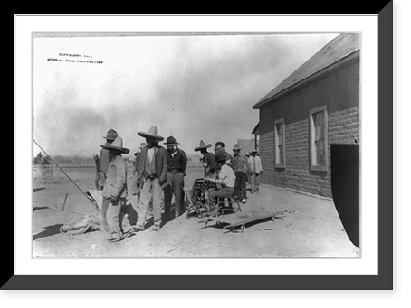 Historic Framed Print, [Mexican War, 1914: U.S. soldiers interviewing Mexican refugees; man wearing bowler hat and Red Cross armband seated in center] - 2,  17-7/8" x 21-7/8"