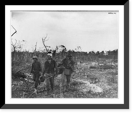 Historic Framed Print, Marine PFC John M. Smith, of St. Louis, being helped off the front lines, Peleliu, Palau Islands,  17-7/8" x 21-7/8"