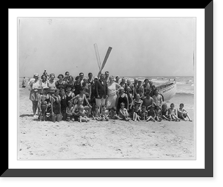 Group of people in front of lifeboat on beach, Avalon, N.J, Antique Print
