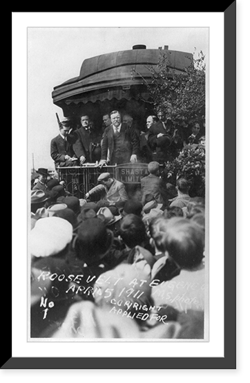 Theodore Roosevelt with others standing on back of train, facing crowd. Eugene, Ore, Historic Reproduction