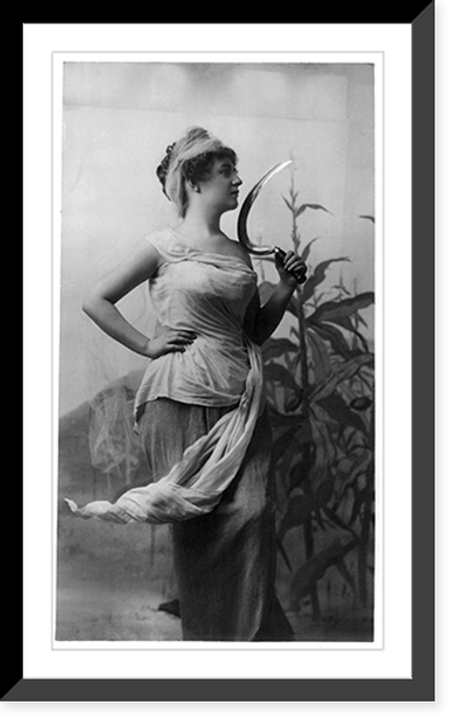 Historic Framed Print, [Young woman modeling: 3/4 lgth., standing, facing right, holding sickle; cornstalks in background],  17-7/8" x 21-7/8"