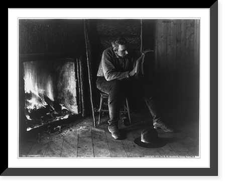 Adirondack Mountains, N.Y.: Absorbed - man reading by fireplace, Historic Print