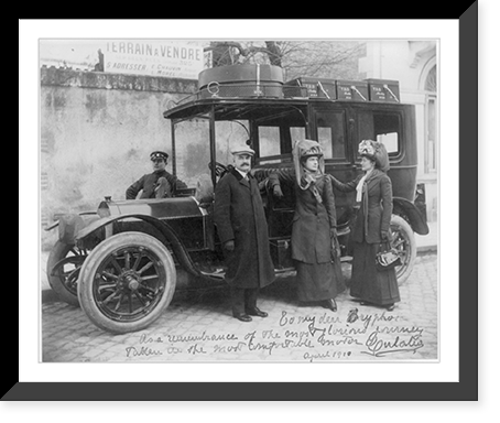 Historic Framed Print, [The Infanta Eulalia of Spain, Mr. and Mrs. Batcheller, and the chauffeur, Adolfo Fusi, standing by automobile, at the beginning of a long journey across Spain],  17-7/8" x 21-7/8"