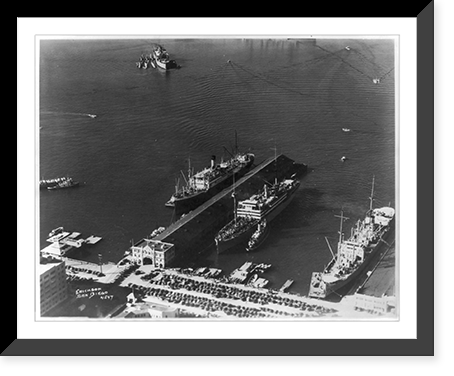 Aerial views of San Diego, California: municipal docks showing transports with troops, Antique Poster