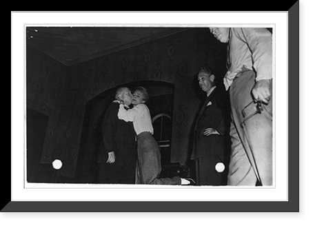 Clare Boothe hugging man in scene from unidentified stage play, Vintage Poster
