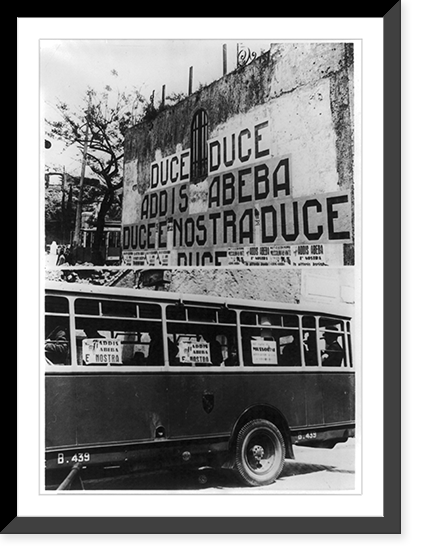 Signs on wall and windows of bus proclaiming victory in Addis Ababa, Rome, Italy, Vintage Print