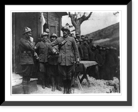 Lieut. Cochran putting on Italian helmet presented by Italian commanding general, Antique Print