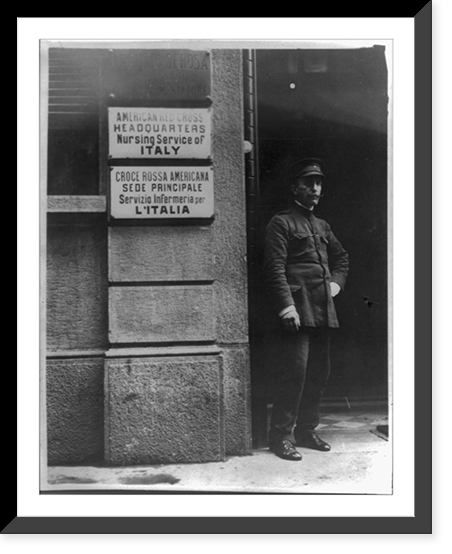 Man standing by bldg. signs in Engl. & Ital, Vintage Print