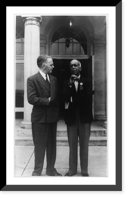 Historic Framed Print, [Walter White, standing, facing right, talking with unidentified man],  17-7/8" x 21-7/8"