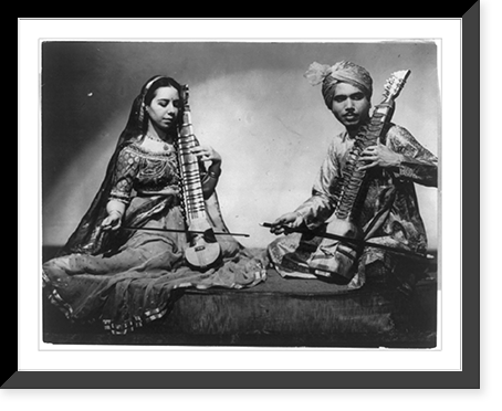 Man and woman in Indian costumes playing music of India on stringed instruments at National Folk Festival of Americans, Philadelphia, Vintage Wall Art
