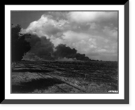 First Army photos of the bombing of Hawaii, Dec. 7, 1941. Smoke from Pearl Harbor and Hickam Field as seen from Kan Highway near John Rodgers Airport Road, Historic Reproduction