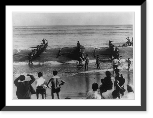 Historic Framed Print, They're off!" Trio of queer-looking craft races for outrigger canoe (6 men) champioship of Hawaii at Waikiki Beach",  17-7/8" x 21-7/8"