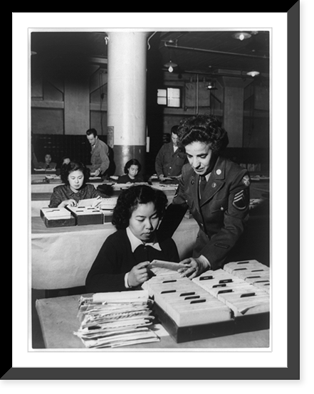 Central Mail Directory Room in the 7th Base Post Office, where WAC Sgt. Sara Polio from Hazelhurst, Penn. checks on the progress of a Japanese employee, Yokohama Classic, Vintage Print
