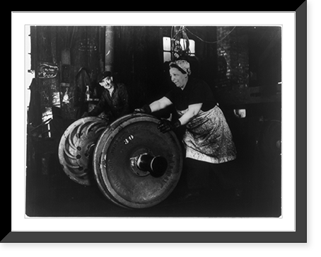 American woman of Italian descent employed as a grinder and hooker, rolling heavy wheel to machines Classic, Antique Print