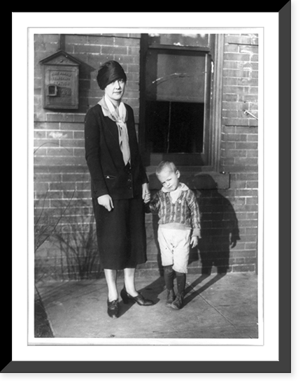 Policewoman holding hand of boy, Washington, D.C, Historic Print