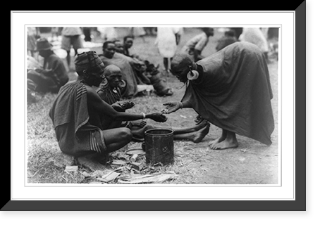 Man, wearing cap, selling wares to woman wearing large earrings at market, Kenya, Antique Print