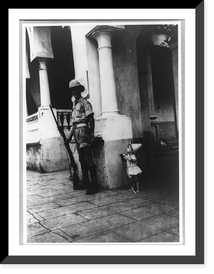 Small child looking up at British sentry in Di&eacute;go Suarez Harbour, Madagascar, during occupation, Vintage Poster