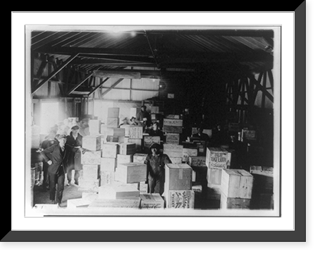 Historic Framed Print, [Men standing in warehouse with cases of confiscated(?) liquor],  17-7/8" x 21-7/8"
