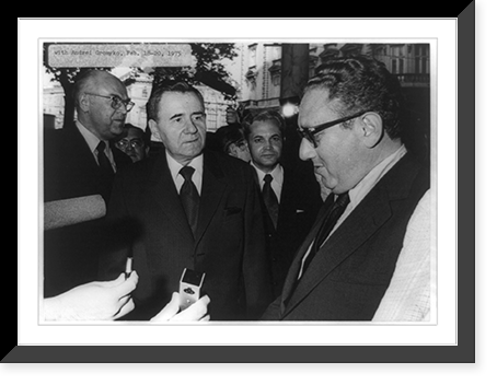 Andrei Gromyko, half-length portrait, standing, facing right, facing Henry Kissinger and other men in front of microphones, Vintage Poster