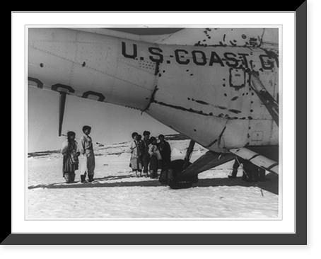 Eskimos of Clyde Inlet, on Baffin Island near Cape Christian in the Canadian Northwest Territories, looking at Coast Guard helicopter from the icebreaker Eastwind, Vintage Print