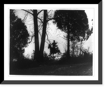 Man on horse jumping fence in fox hunt in Virginia, Historic Reproduction