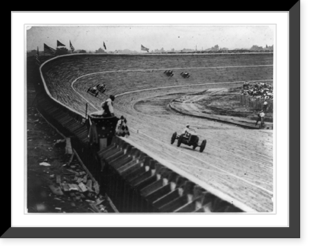Automobile racing on curved wood track, probably in or near Washington, D.C., with flag man in foreground, Antique Print