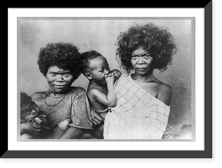 Head-and-shoulders portrait of two Negrito women, each holding a baby, Philippine Islands, Historic Print