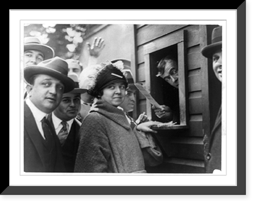 Historic Framed Print, Miss Elsie Tydings, who had the distinction of purchasing the first ticket sold for a World Series in the National Capitol. Miss Tydings was No. 1 in the first line selling tickets this morning,  17-7/8" x 21-7/8"
