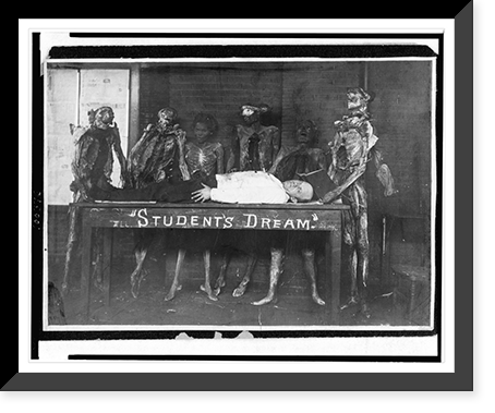 Man lying on table labeled student's dream" surrounded by figures of mummies", Historic Print