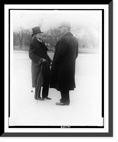 Dr. Mary Walker, dressed in slacks and overcoat, talking to man on street, Historic Print