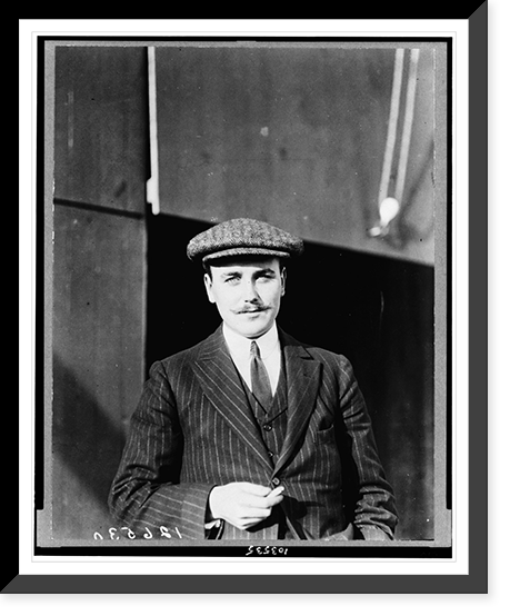 Historic Framed Print, [Anthony J. Drexel, Jr., millionaire aviator, half-length portrait, standing, facing forward, wearing cap],  17-7/8" x 21-7/8"