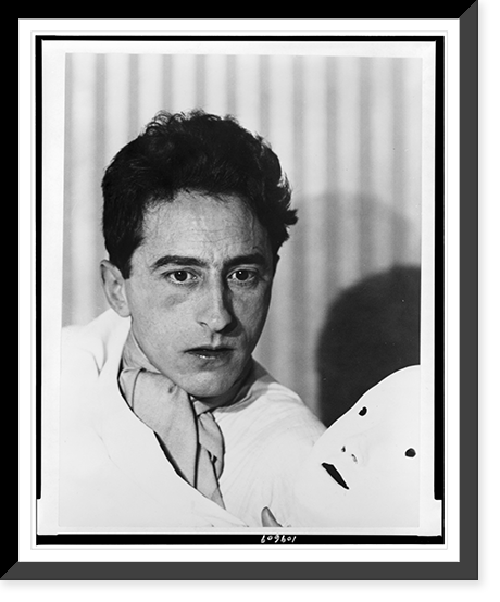 Jean Cocteau, head-and-shoulders portrait, facing slightly right, holding mask.Photographie de Berenice Abbott, Paris, Antique Print