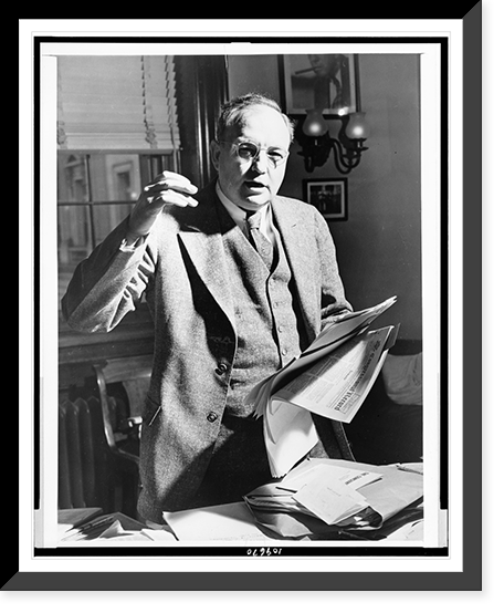 Senator James O. Eastland, half-length portrait, standing, facing front, holding paper and gesturing, Vintage Poster