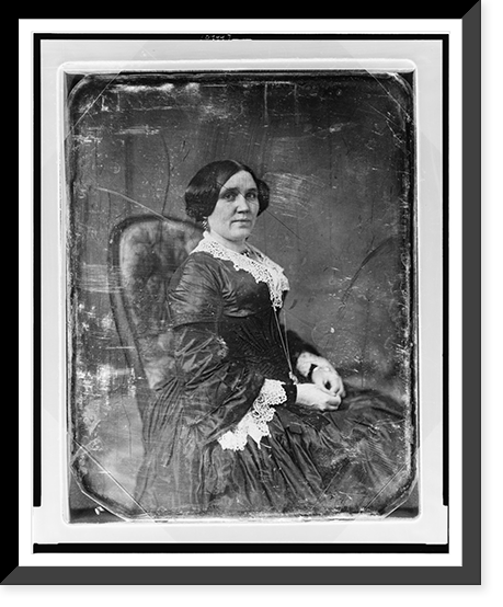 Unidentified woman, about 40 years of age, three-quarter length portrait, body to right, facing front, seated in upholstered chair, hands in lap, Antique Print