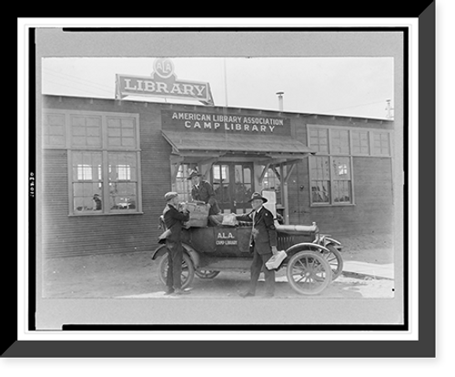 Historic Framed Print, [Three men at automobile in front of American Library Association, Camp Cody library],  17-7/8" x 21-7/8"