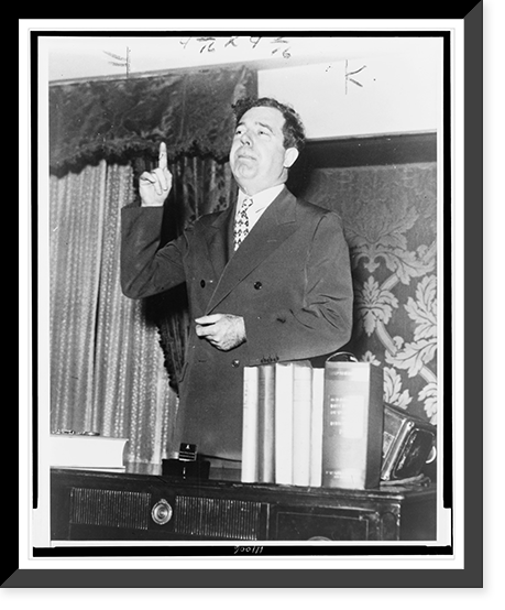 Historic Framed Print, [Huey P. Long, half-length portrait, standing, facing left, gesturing with right arm, as he speaks],  17-7/8" x 21-7/8"