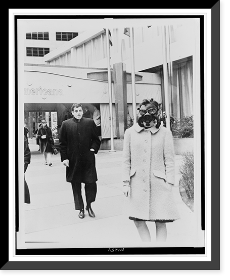 Woman wearing gas mask outside of Americana hotel.World Journal Tribune photo by Nat Fein. Classic, Antique Poster