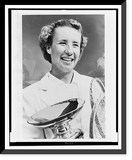Maureen Connolly, head-and-shoulders portrait, facing slightly right, holding championship cup and two tennis rackets, Antique Print