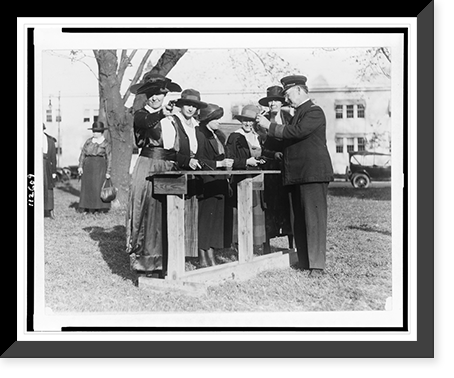 Women police officers inspecting and practicing with handguns, Antique Print