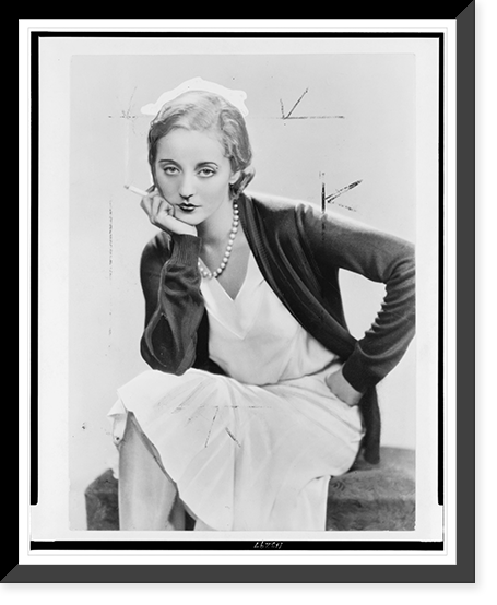 Tallulah Bankhead, three-quarter length portrait, seated, facing slightly left, smoking cigarette.portrait by Dorothy Wilding, Vintage Wall Art