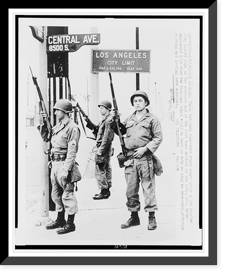 Three National Guardsmen stand guard under a Los Angeles city limits sign in the southern end of the riot torn section of the city, Historic Print